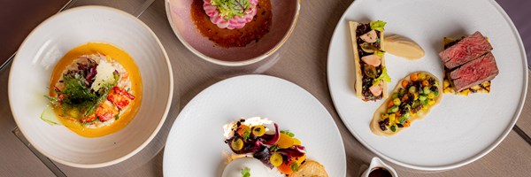 A selection of dishes of different colours on a table at the Collins Room at The Berkeley