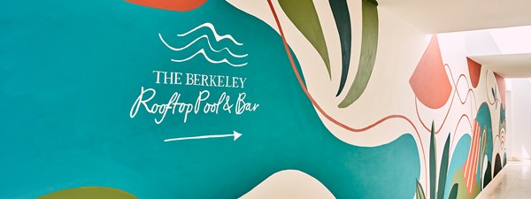 The mural painting on the wall leading up to The Berkeley Rooftop Pool and Bar