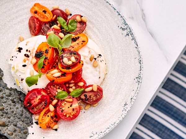 A tomato, pine nut and burrata salad at The Berkeley Rooftop Pool & Bar.