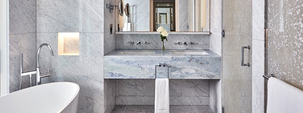 Marble bathroom with bath tub and shower