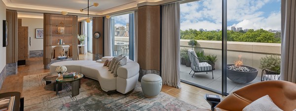 Living area of Hyde Park Penthouse with modern architecture and lighting, neutral furniture and soft furnishings with terrace